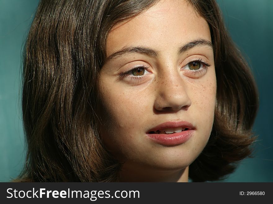 Beautiful young girl with big brown eyes and brown hair