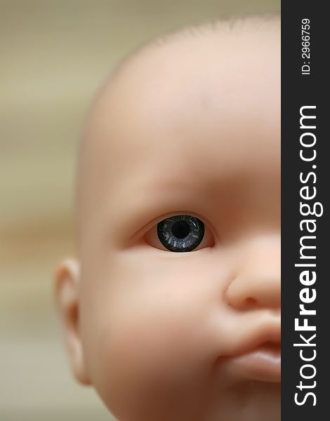 A close up of a baby doll face