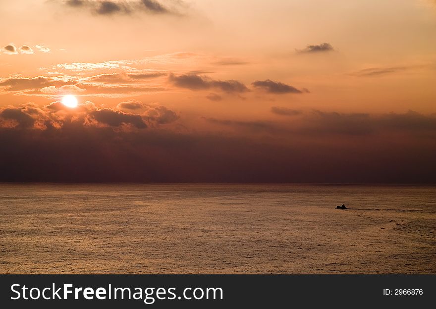 Fisher ship departure at sunset