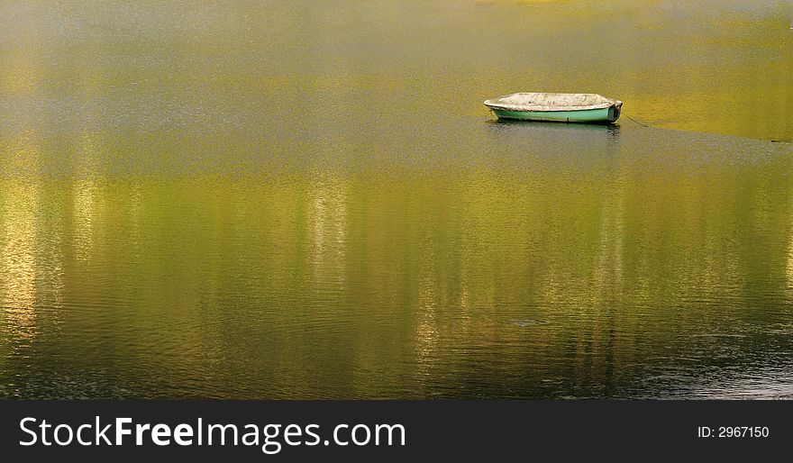 Lonely boat on peaceful water