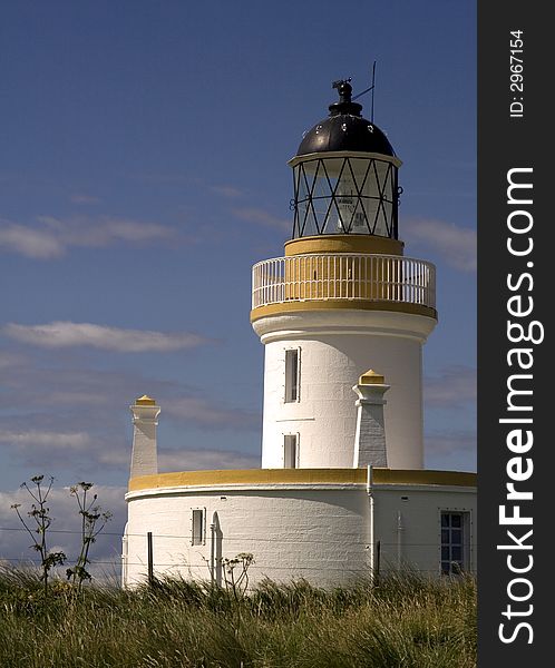 Yellow and white lighthouse on the east coast of Scotland