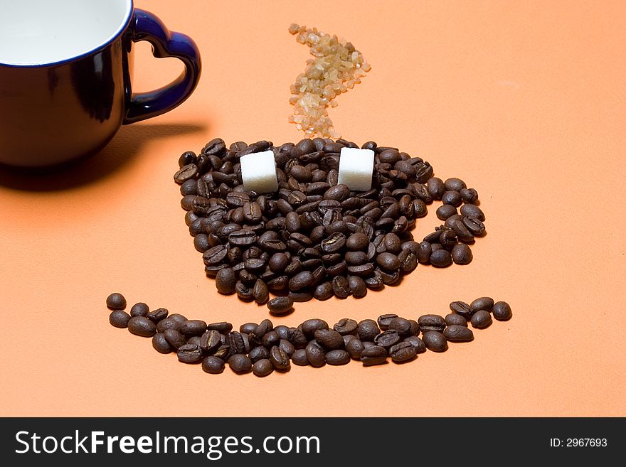 Cup of coffee on orange background