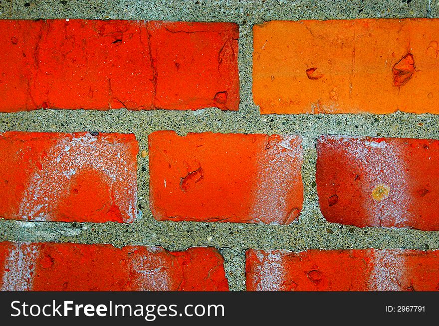 A portion of a red brick wall.