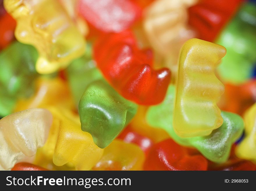 Close-up of many gummi bears in various colors