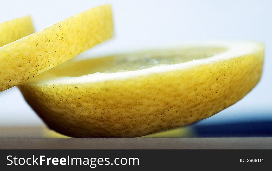 Tight close-up of freshly cut slices of lemon. Tight close-up of freshly cut slices of lemon