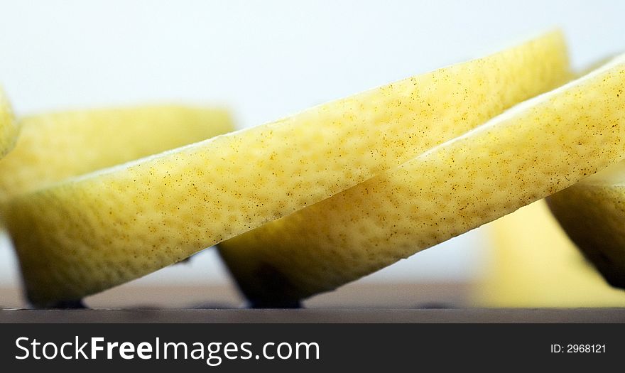 Tight close-up of freshly cut slices of lemon. Tight close-up of freshly cut slices of lemon