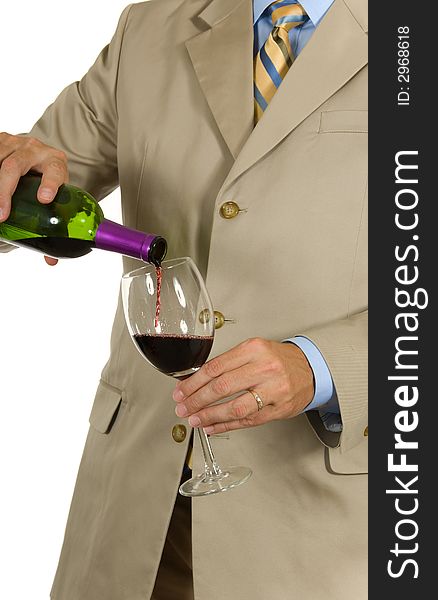 Man in suit pouring red wine on white background. Man in suit pouring red wine on white background