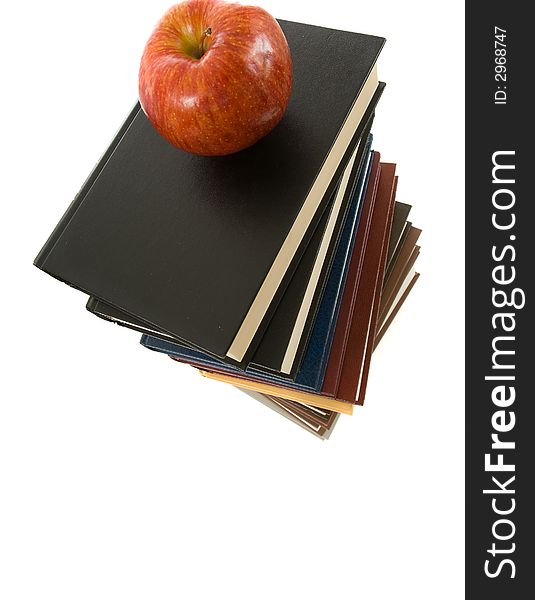 Huge stack of books with a shiny red apple on top. Huge stack of books with a shiny red apple on top