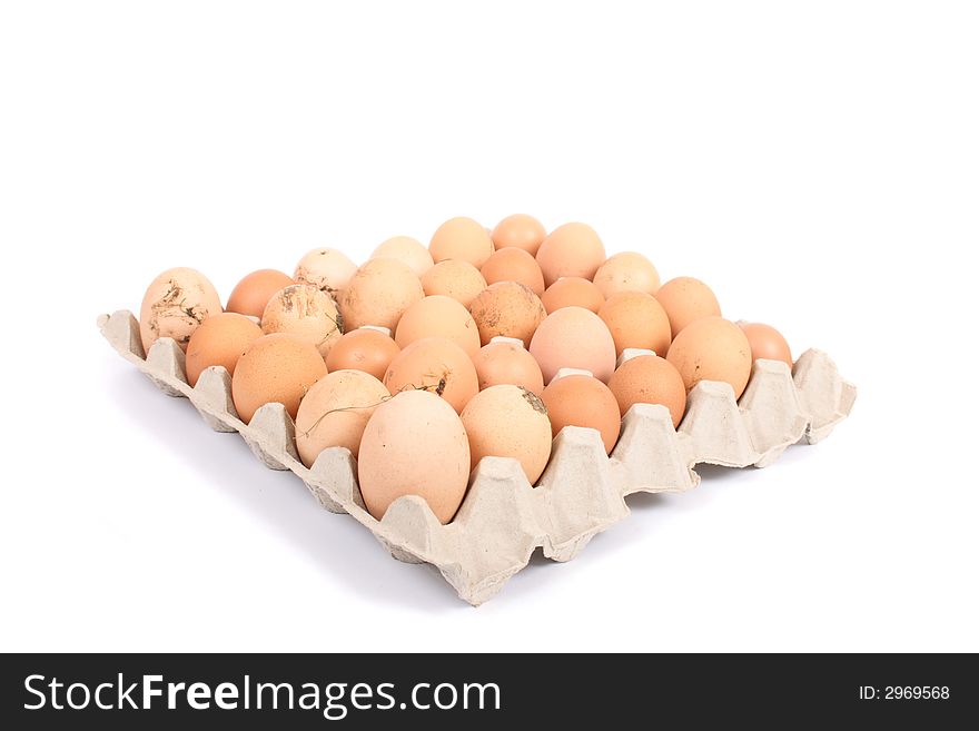Many brown eggs in the paper case