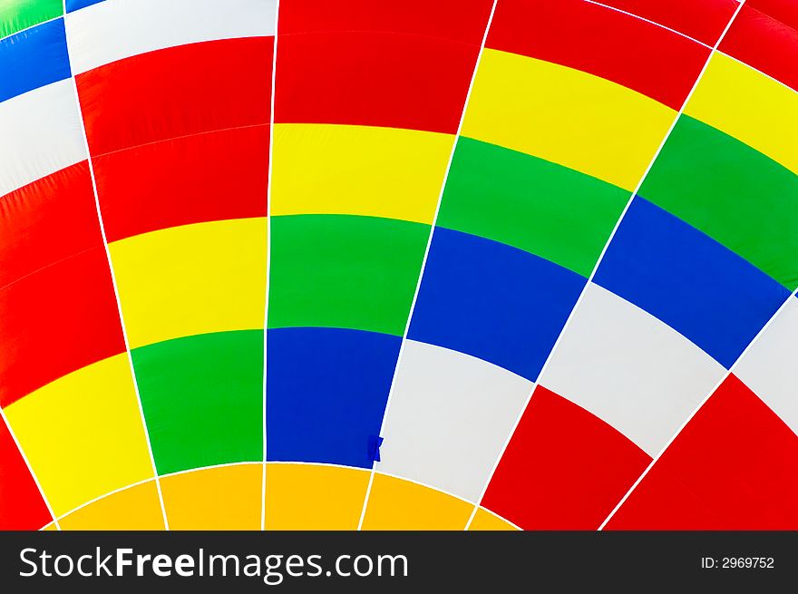 Close up of a hot air balloon showing a colorful mosaic pattern.