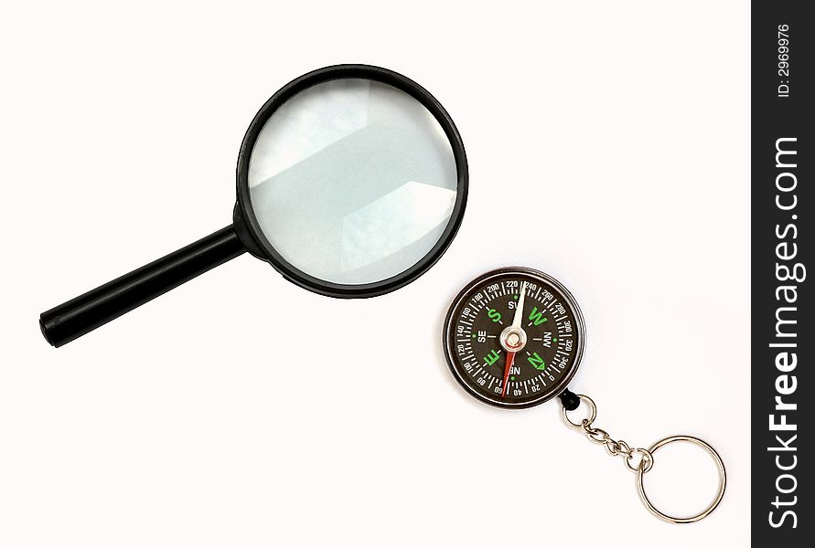 An picture of magnifier and compass. An picture of magnifier and compass