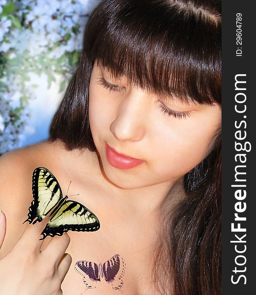Photography of the girl with scene of the butterfly in image of the springtime