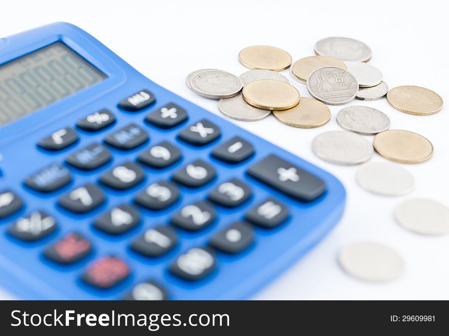 calculator and thai coins on white background.