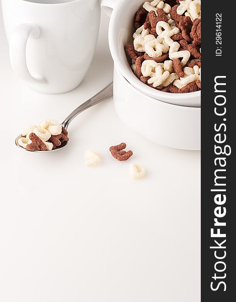 Alphabet cereal in the white bowl, vertical