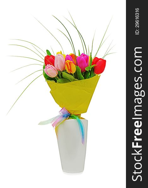 Flower bouquet from colorful tulips in white vase