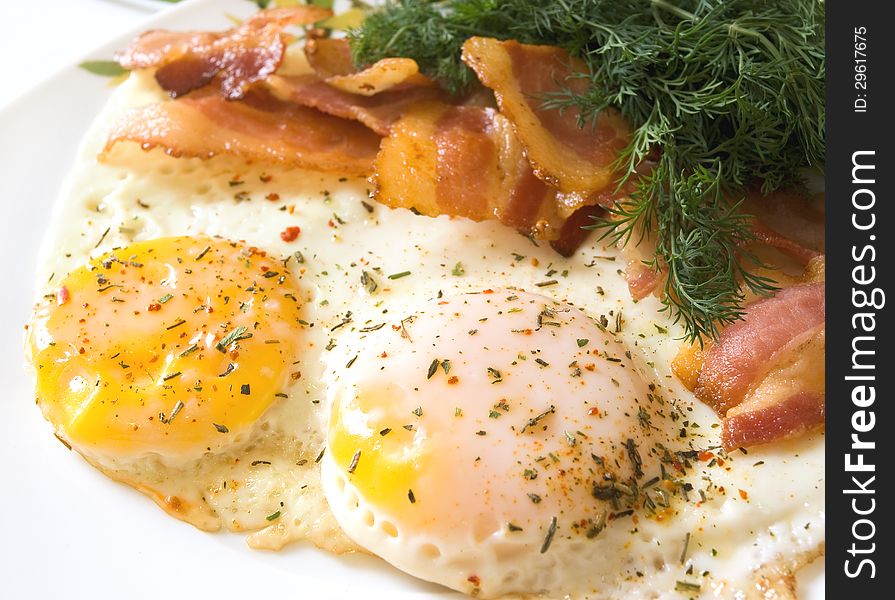 Breakfast of bacon and fried eggs. Breakfast of bacon and fried eggs