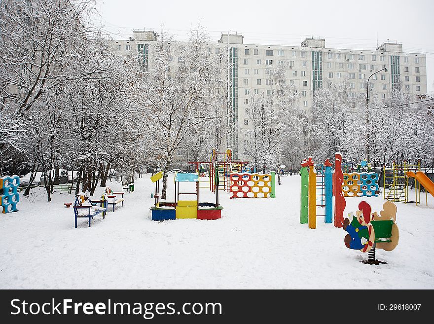 Playground in a russian city yard in the winter. Playground in a russian city yard in the winter