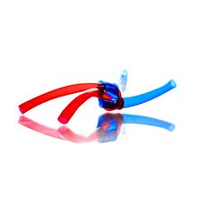 Two Red And Blue PVC Hoses Tied Stock Image