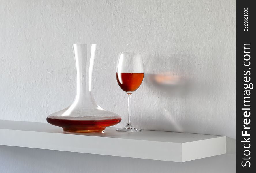 Still life with red wine on white background