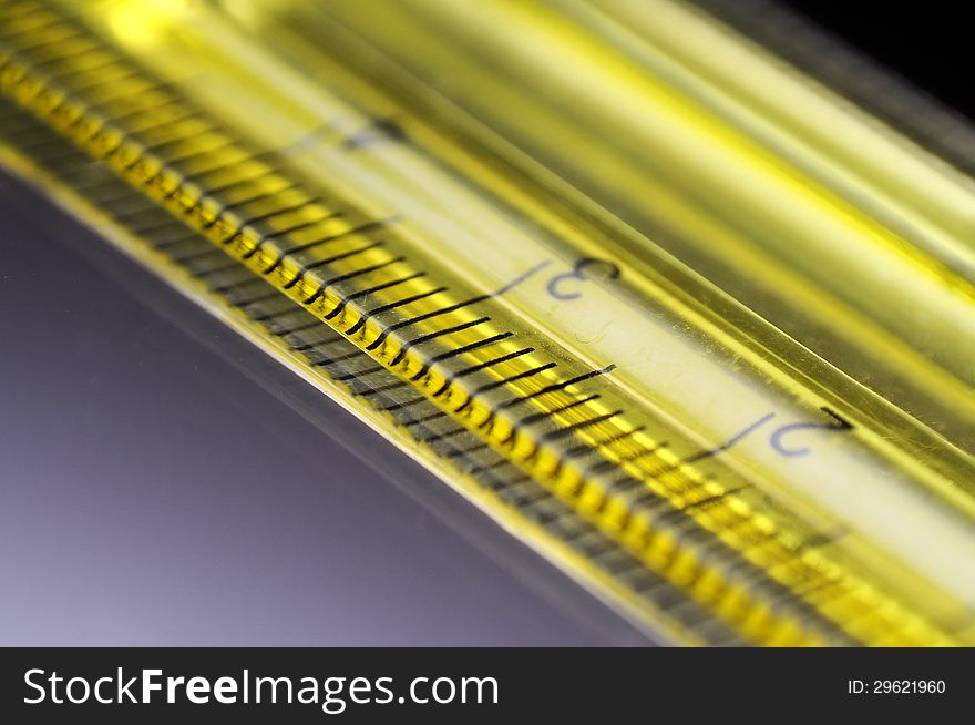 Macro shot of yellow transparent ruler with measure. Macro shot of yellow transparent ruler with measure