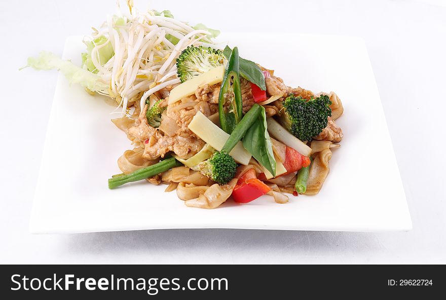 Flat Rice Noodle Stir Fried With Thai Herb  And Basil.