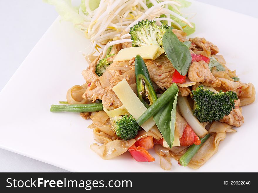 Flat Rice Noodle Stir Fried With Thai Herb  And Basil.