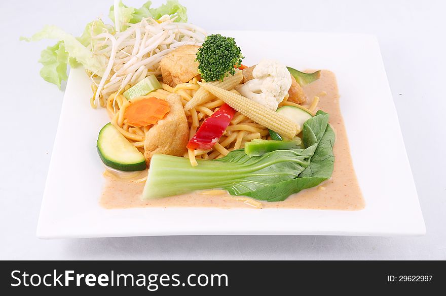 Hokkien Noodles With Red Curry Sauce And Fresh Vegetables