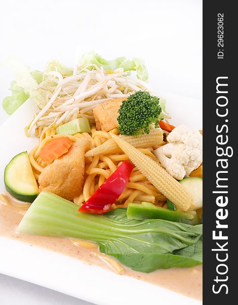 Hokkien Noodles With Red Curry Sauce And Fresh Vegetables