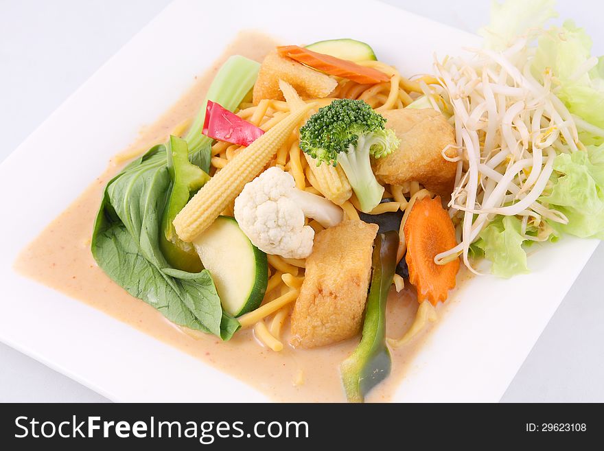 Hokkien Noodles With Red Curry Sauce And Fresh Vegetables
