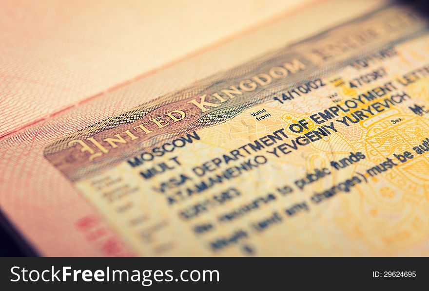 An open passport, tourist visa