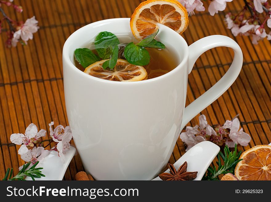 Healthy herbal tea abd cherry blossoms