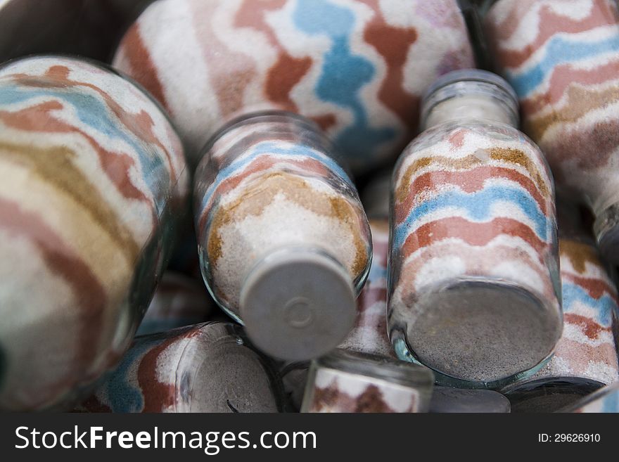 Multicolor sand in glass bottle