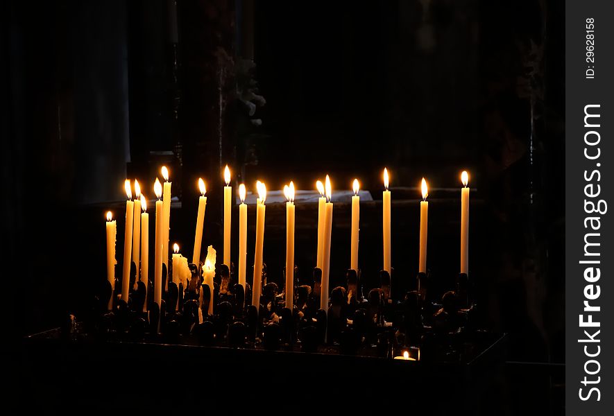 Church candles on a dark background