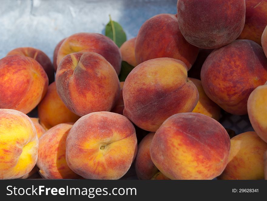 Fresh organic peaches at a market