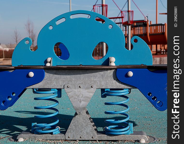 Childrens blue playground toy in the park. Childrens blue playground toy in the park.