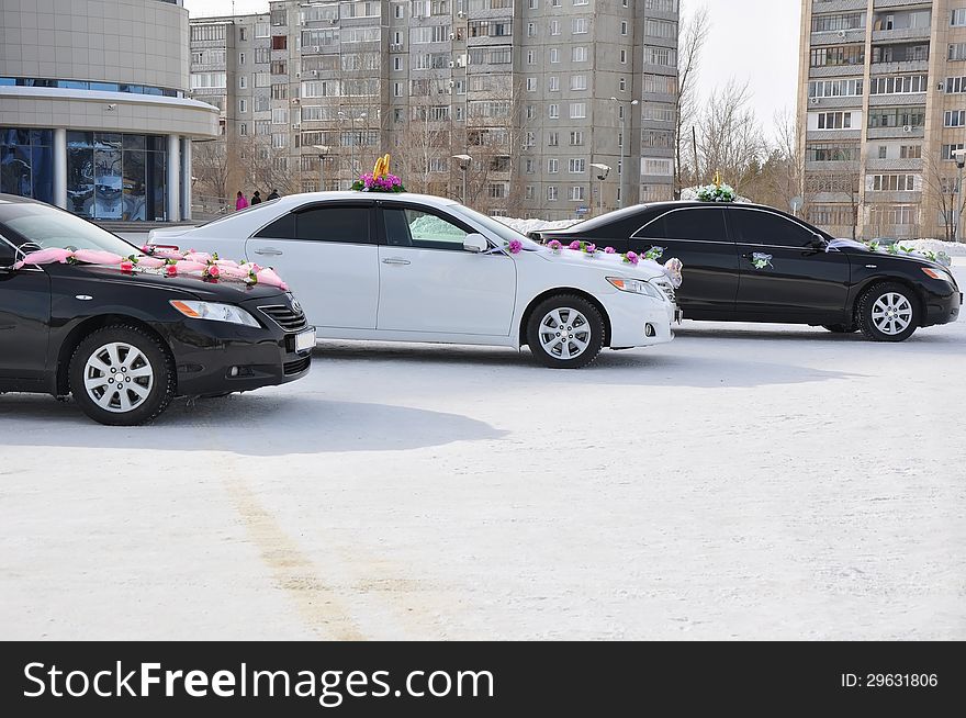 Wedding car decoration. Wedding cortege, delivers the groom and the bride to the wedding site