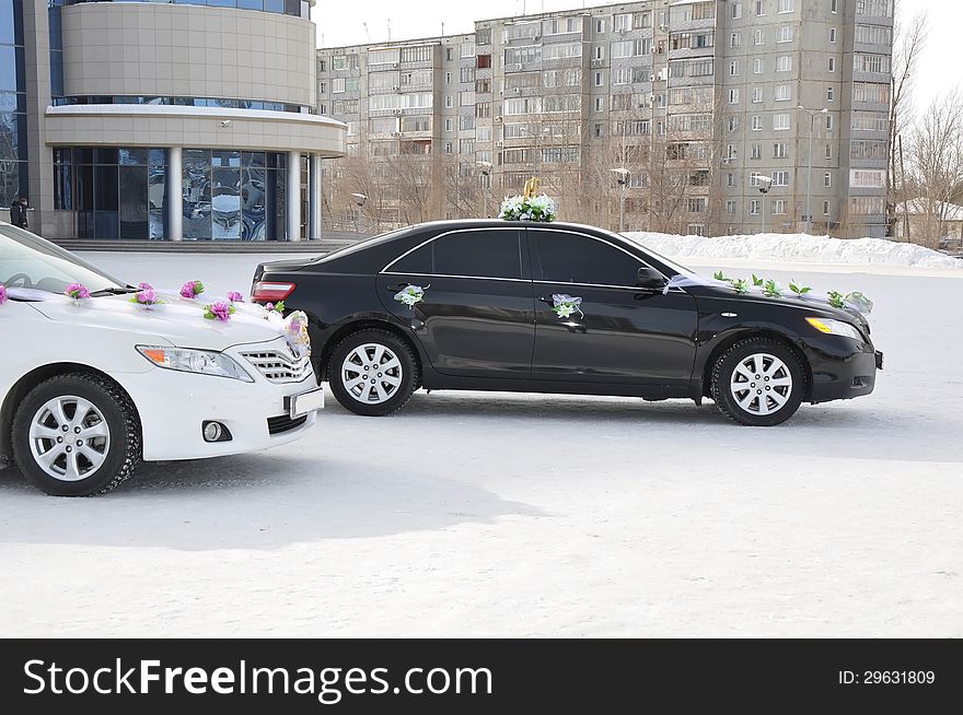 Wedding car decoration. Wedding cortege, delivers the groom and the bride to the wedding site