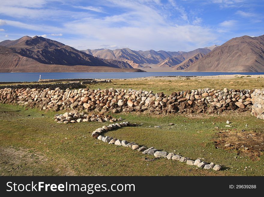 Pangong lake (Pangong Tso) is an endorheic lake in the Himalayas situated at a height of about 4,350 m (14,270 ft). It is 134 km (83 mi) long and extends from India to Tibet. Pangong lake (Pangong Tso) is an endorheic lake in the Himalayas situated at a height of about 4,350 m (14,270 ft). It is 134 km (83 mi) long and extends from India to Tibet.