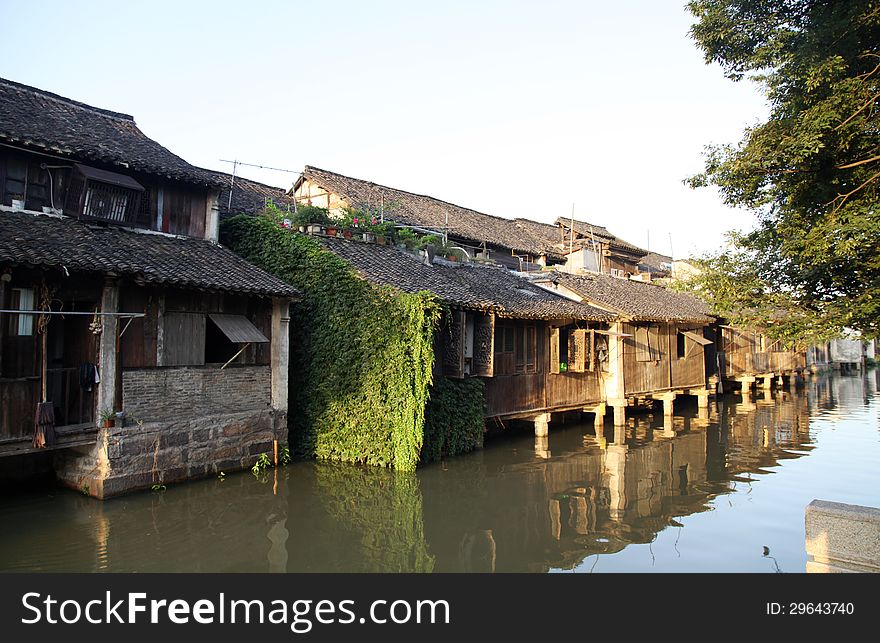 Wuzheng Landscape in Dusk, shot in July. Wuzheng is an old town built over water. All woden house are in lines. Beautiful