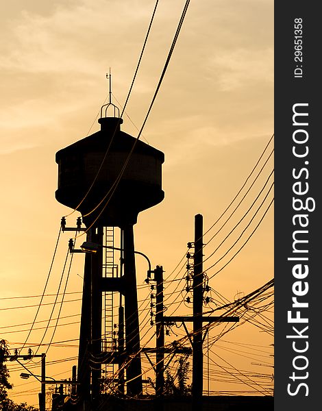 The silhouette of a water tower at sunset