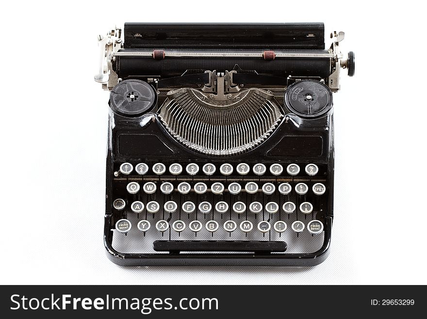 Old typewriter isolated on white background