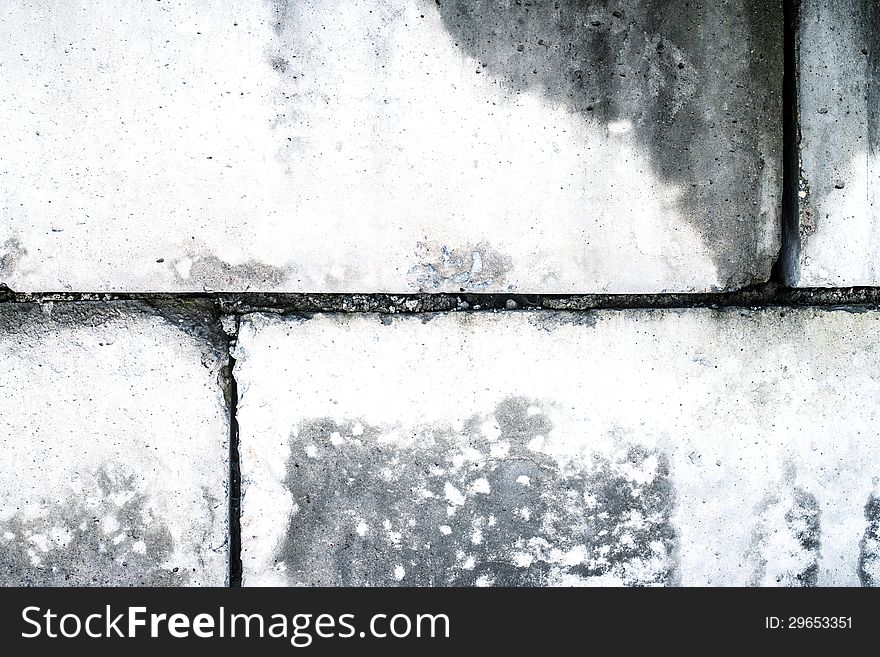 Dirty old wall from concrete blocks as a background