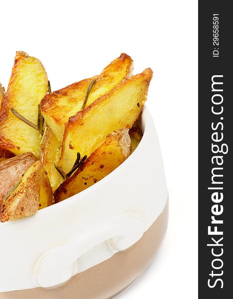 Roasted Potato Wedges with Rosemary in Bowl closeup on white background