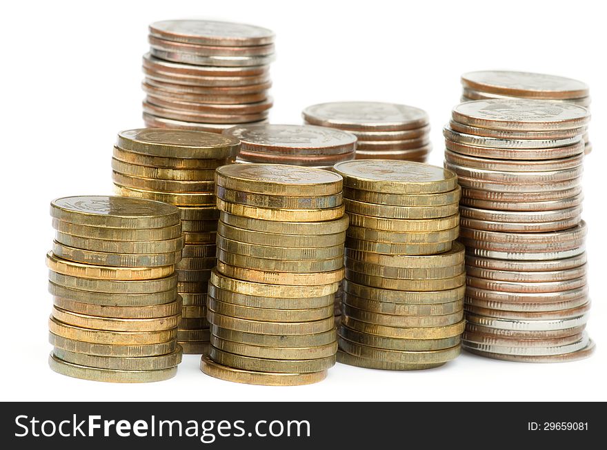 Stacks of Silver and Gold Coins closeup isolated on white background. Stacks of Silver and Gold Coins closeup isolated on white background