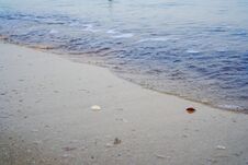 Close-up View Of Small Waves On The Shoreline. Royalty Free Stock Image