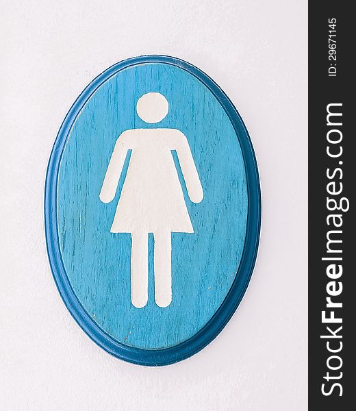 Wooden woman rest room sign