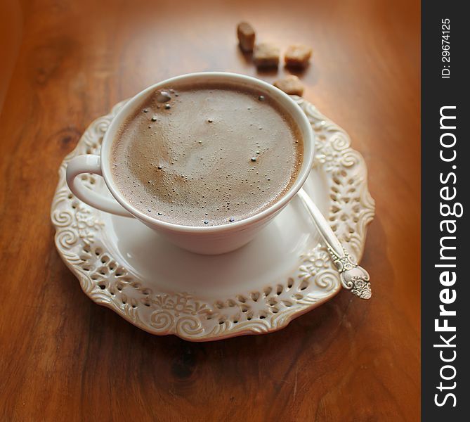 Coffee cup on a wooden background ( close up )