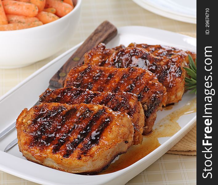 Grilled pork loins on a serving platter