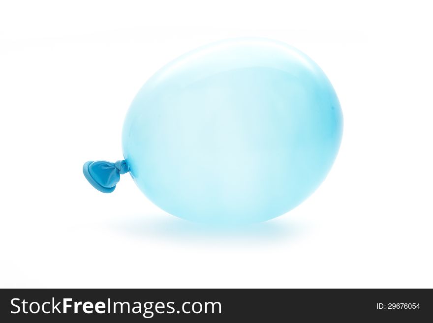 Single blue small balloon macro isolated on white