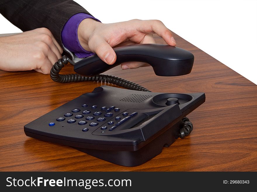 Young businessman raplacing telephone receiver. Young businessman raplacing telephone receiver